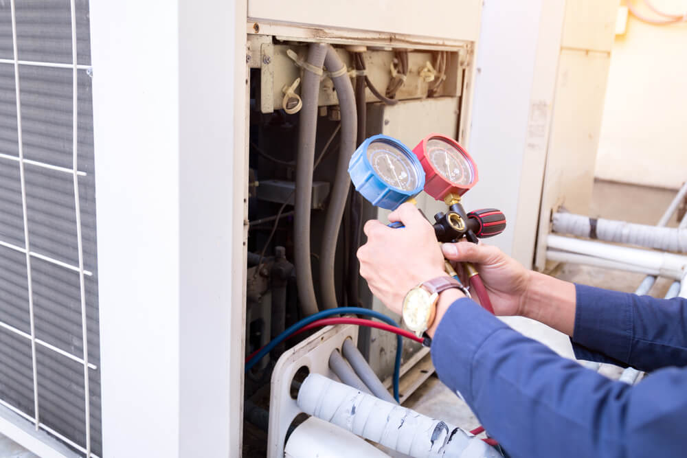 An electrician fitting a light bulb